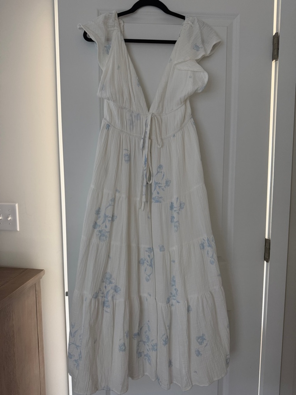 White Maxi Dress with Light Blue Floral Accent and Pockets